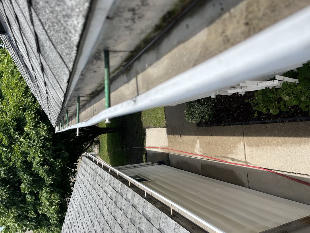 The same gutter cleared out and flowing freely
