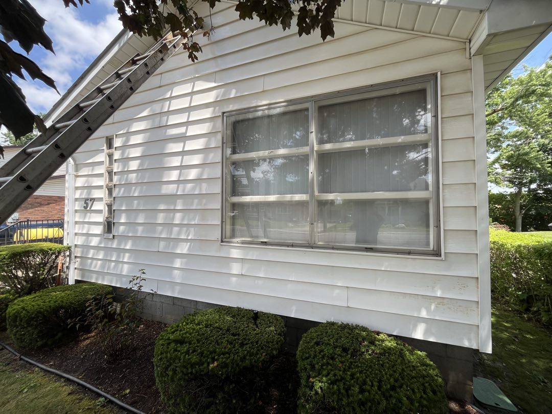 The same siding after Stonegate removed the rust stains