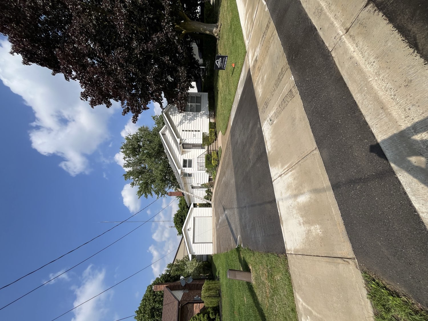 A freshly pressure-washed driveway and walkway at a home in Strathroy