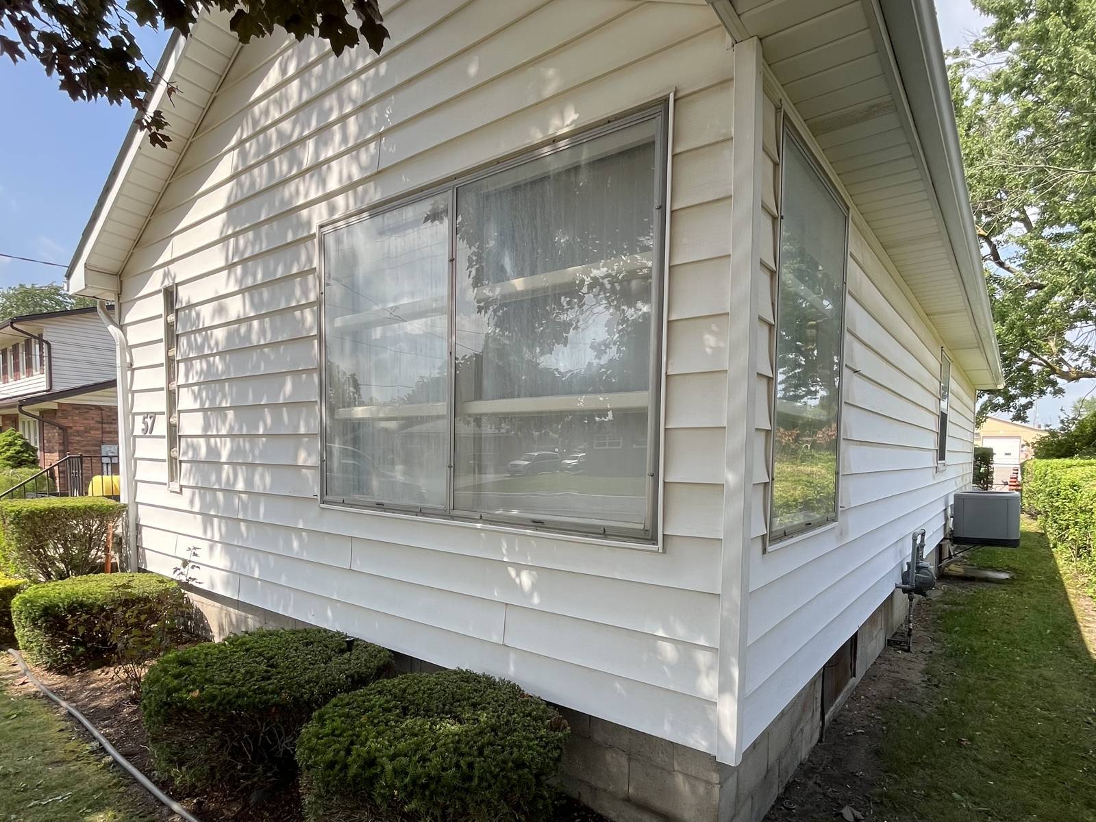 A home's siding cleaned bright and rust-free by Stonegate Exteriors in Strathroy